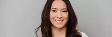 Smiling Asian woman in white shirt